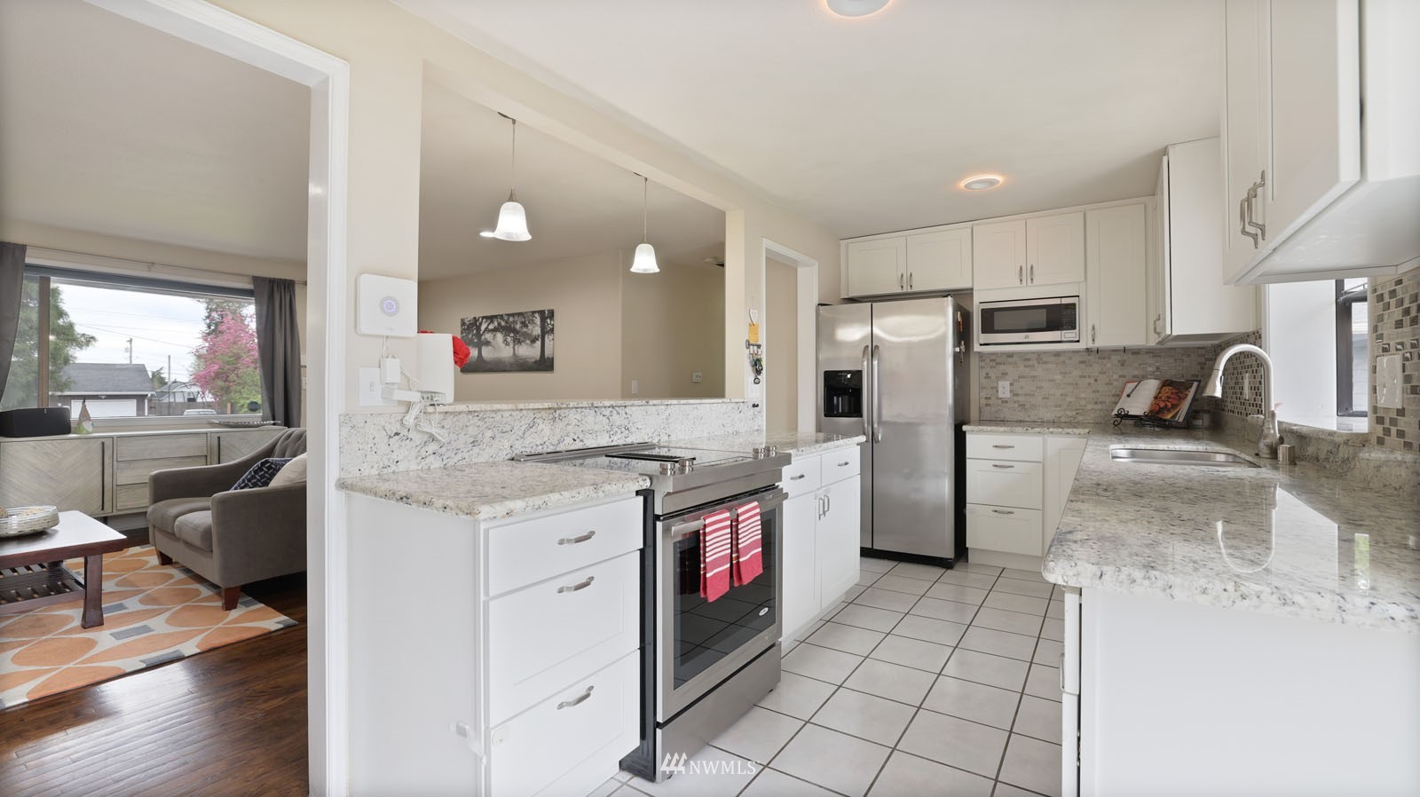 123 234th Street Southwest Bothell, WA 98021 - Photo 6 of 38 a kitchen with a sink cabinets and stainless steel appliances