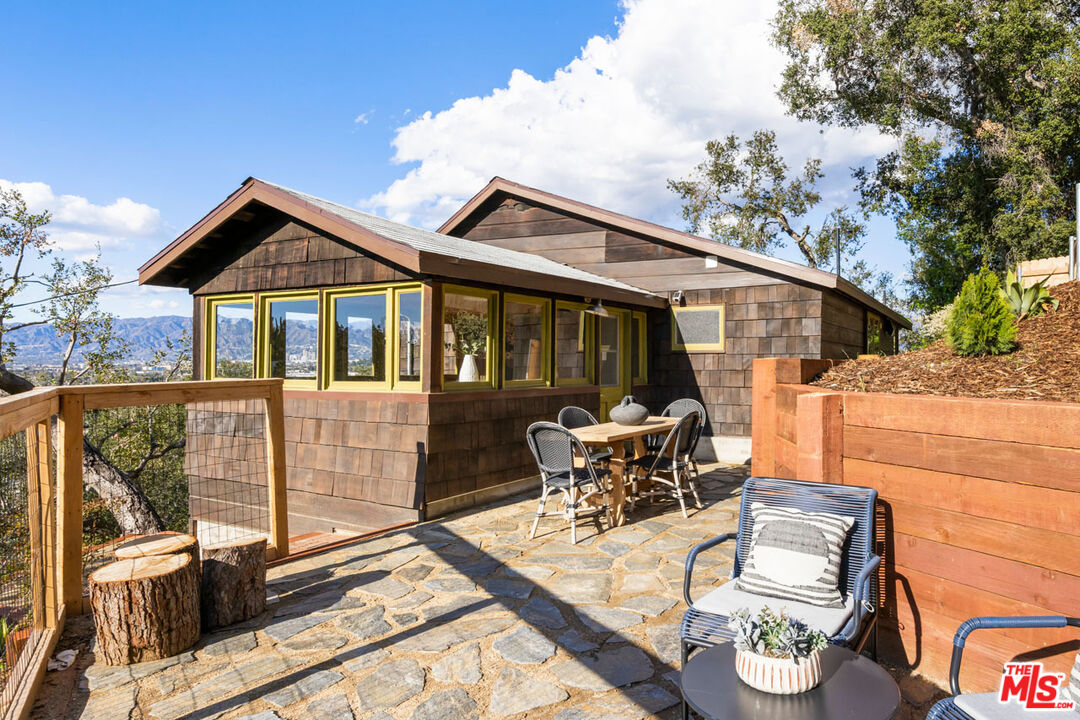 2006 El Moran Street Los Angeles, CA 90039 - Photo 1 of 35 a view of a house with backyard sitting area and garden