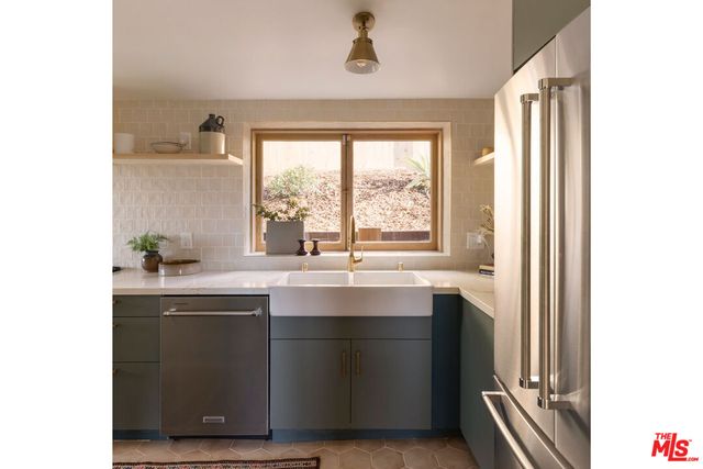a kitchen with a sink and a window