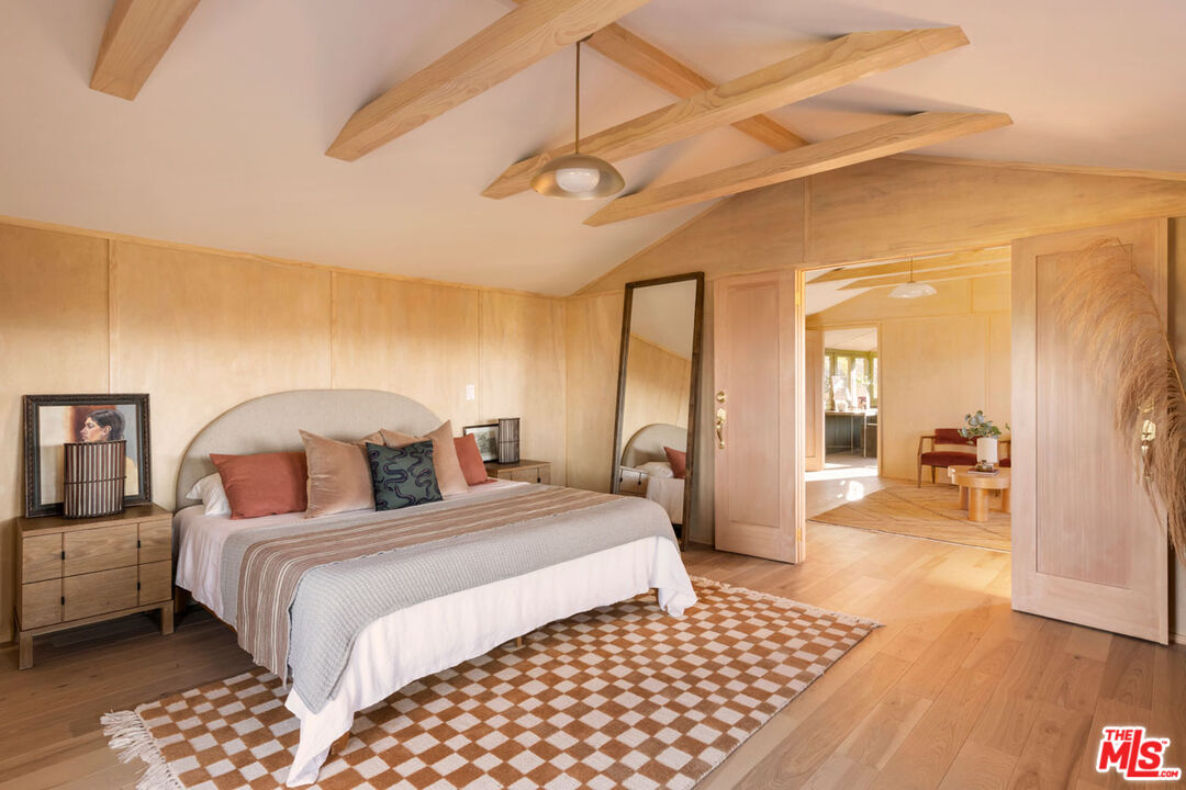 2006 El Moran Street Los Angeles, CA 90039 - Photo 14 of 35 a bedroom with a bed a mirror and lamp