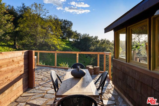 a view of balcony with furniture