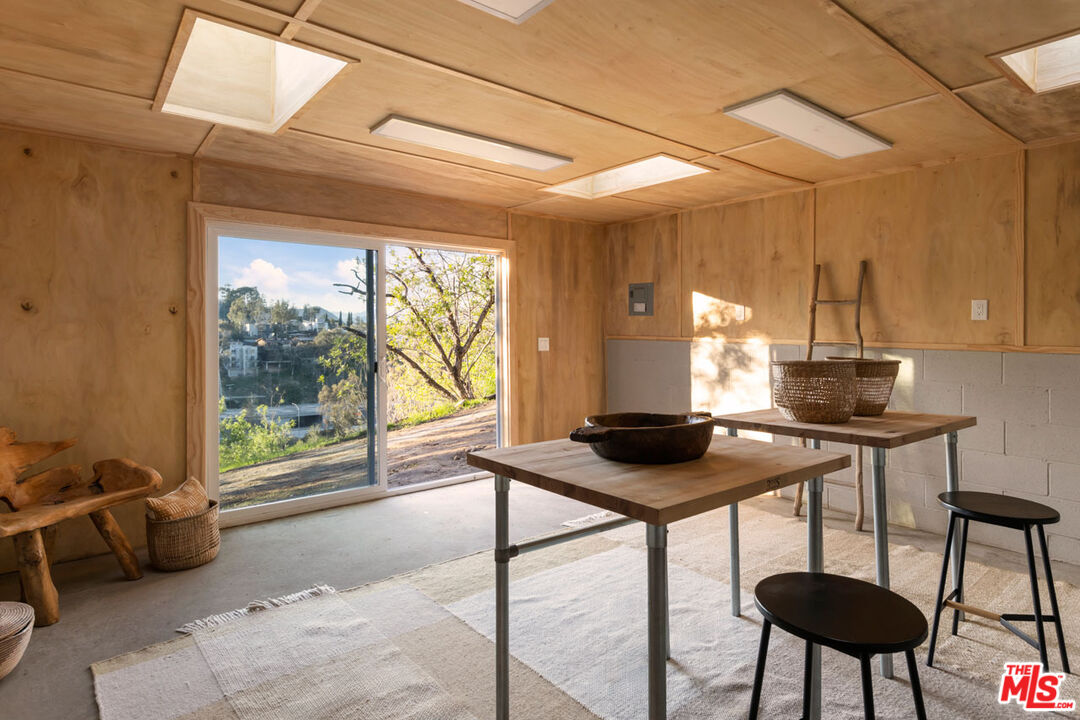 2006 El Moran Street Los Angeles, CA 90039 - Photo 27 of 35 a view of a workspace with furniture and a window