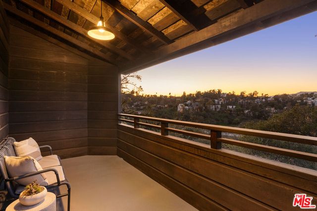 a view of balcony with chairs
