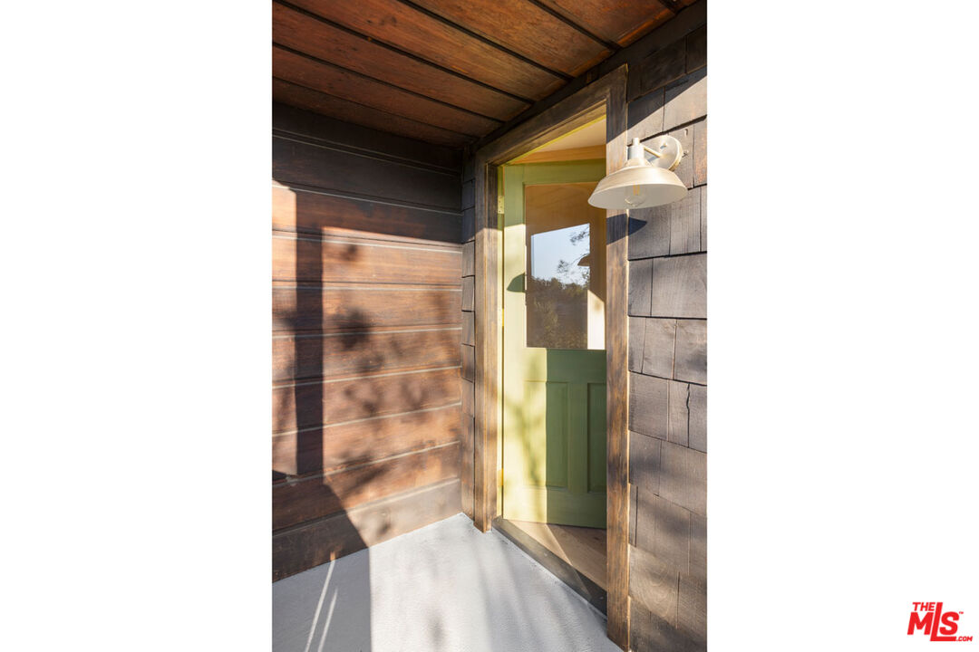 2006 El Moran Street Los Angeles, CA 90039 - Photo 4 of 35 a bathroom with a glass shower door and a glass door