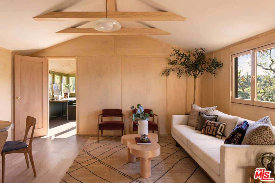 2006 El Moran Street Los Angeles, CA 90039 - Photo 6 of 35 a living room with furniture and a potted plant