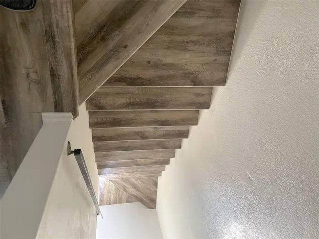 an entryway with wooden floor