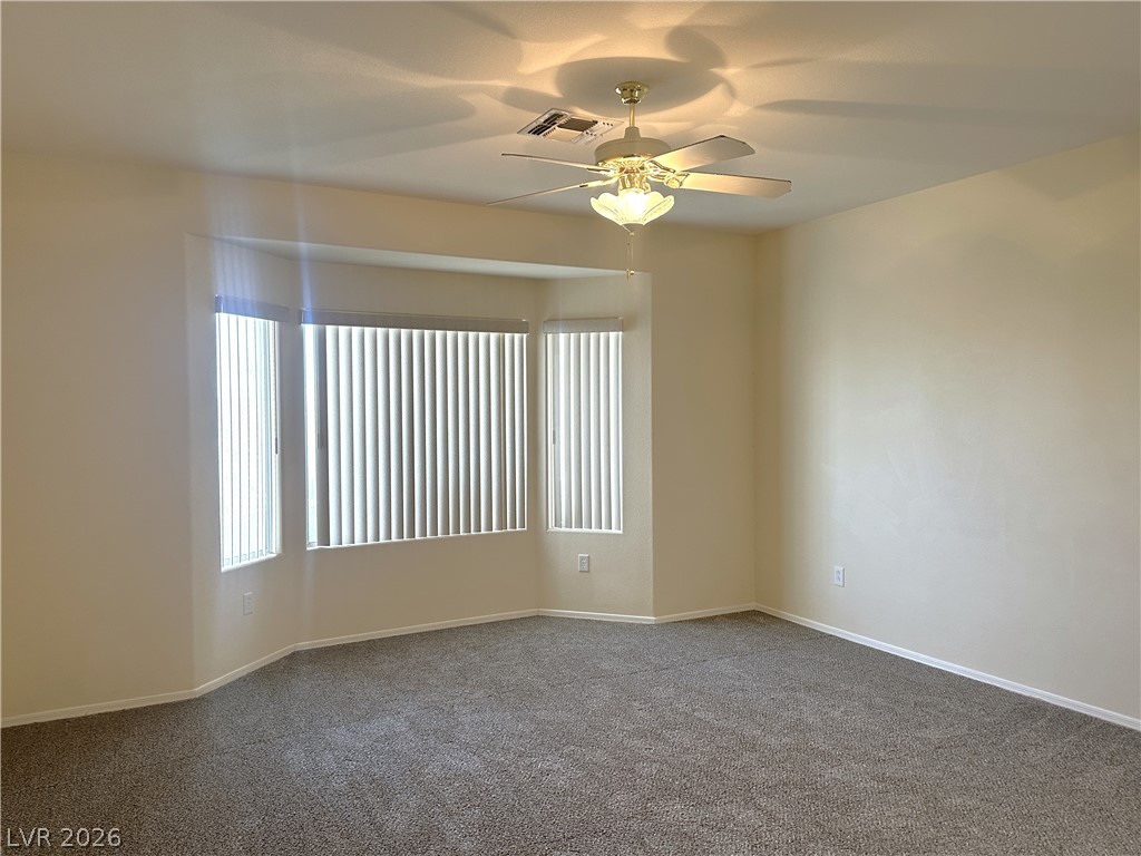 3034 Canal Walk Road Henderson, NV 89052 - Photo 14 of 24 This inviting room offers ample space, bathed in natural light, perfect for comfortable living.