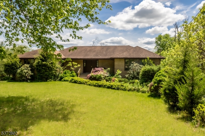 a view of a house with a yard and garage