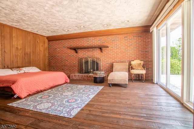 a bedroom with a large bed and a large window