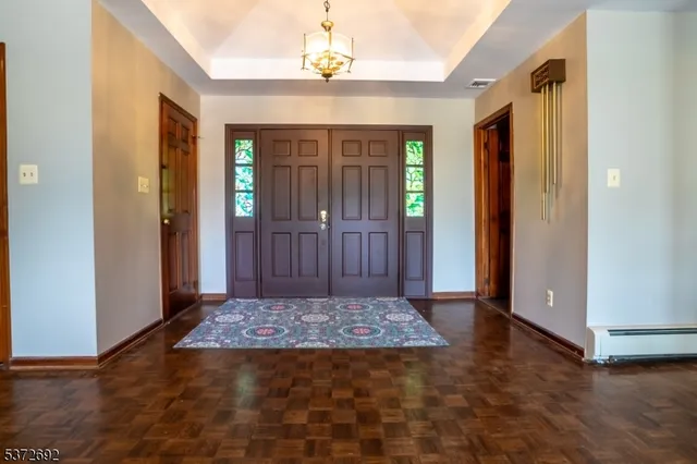 wooden floor in a hall with an entryway