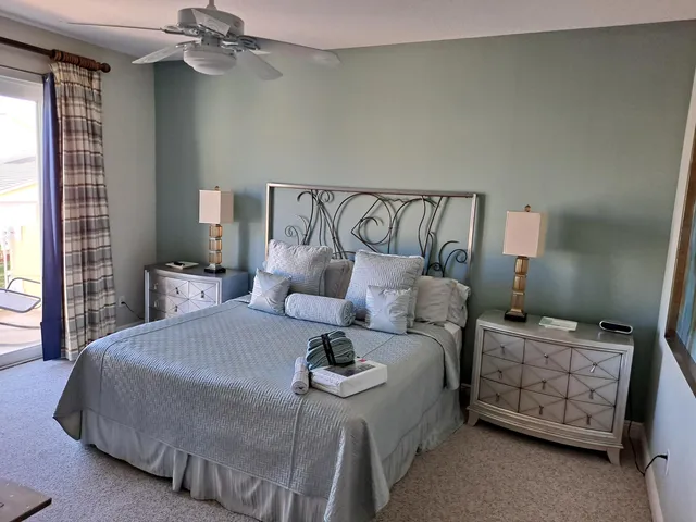 a bedroom with a bed and a night stand