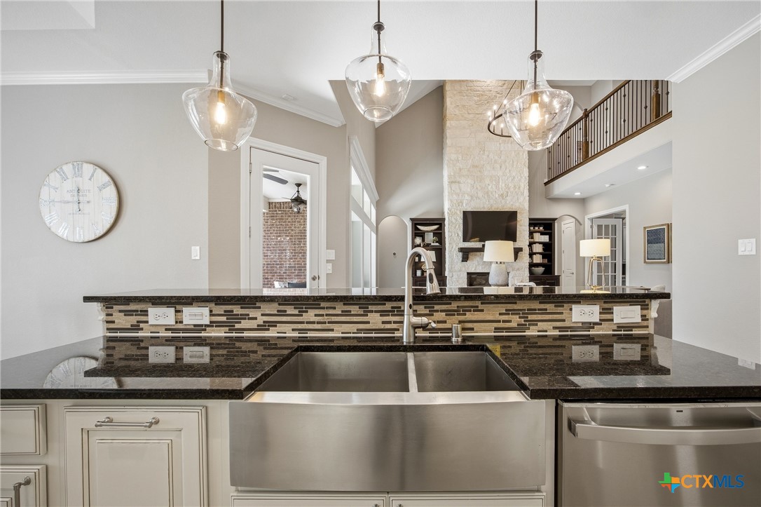 2427 Anderson Point Lane Spring, TX 77388 - Photo 19 of 47 a view of a kitchen with a sink and chandelier