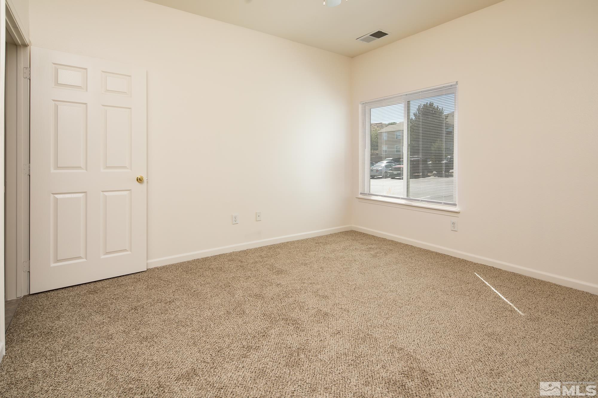 200 Talus Way, Unit 414 Reno, NV 89503 - Photo 11 of 22 an empty room with windows