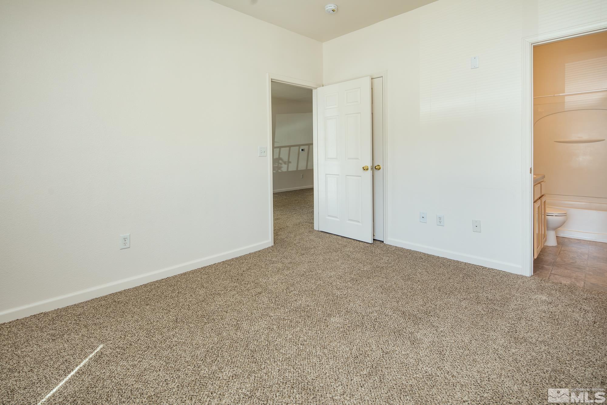 200 Talus Way, Unit 414 Reno, NV 89503 - Photo 13 of 22 an empty room with a bathroom