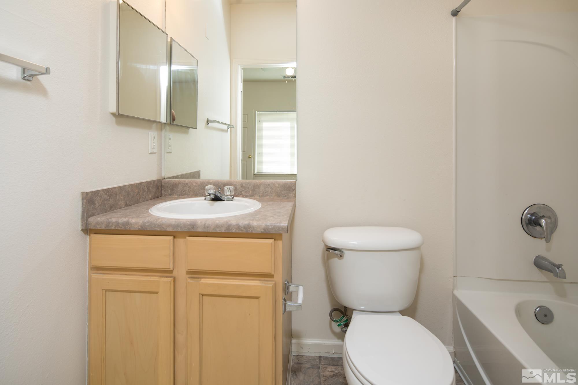 200 Talus Way, Unit 414 Reno, NV 89503 - Photo 17 of 22 a bathroom with a sink toilet and shower