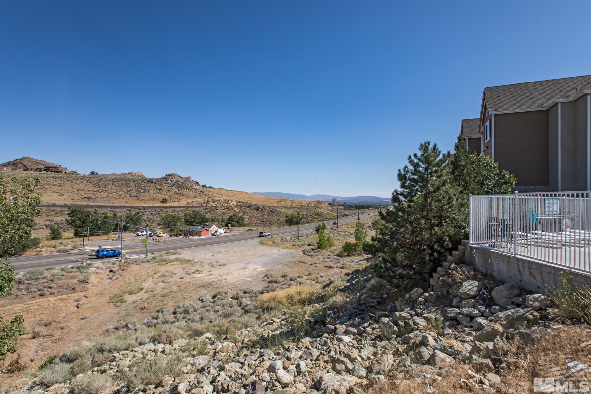 200 Talus Way, Unit 414 Reno, NV 89503 - Photo 19 of 22 a view of lake with mountain and trees