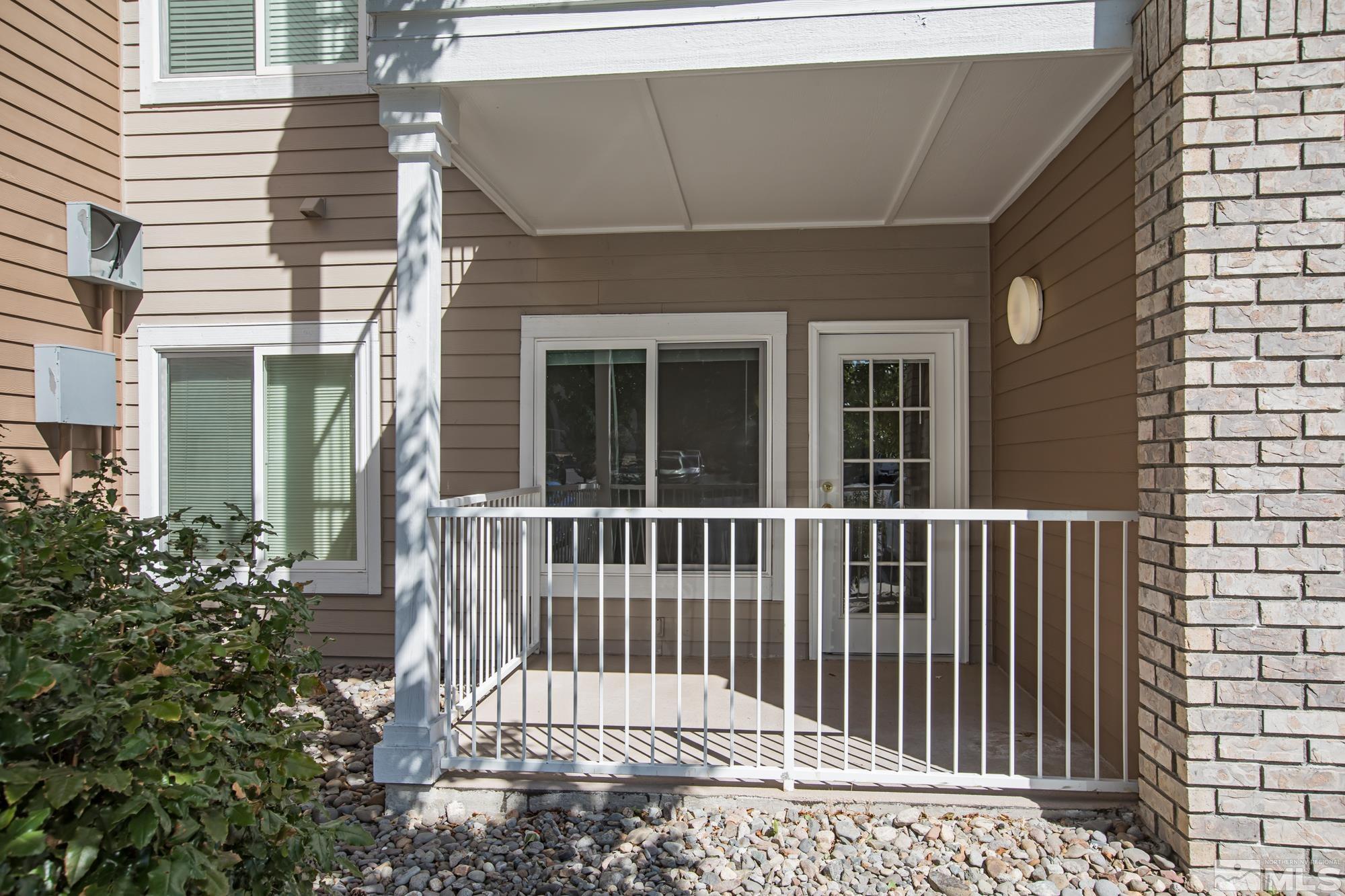 200 Talus Way, Unit 414 Reno, NV 89503 - Photo 5 of 22 a front view of a house with a yard