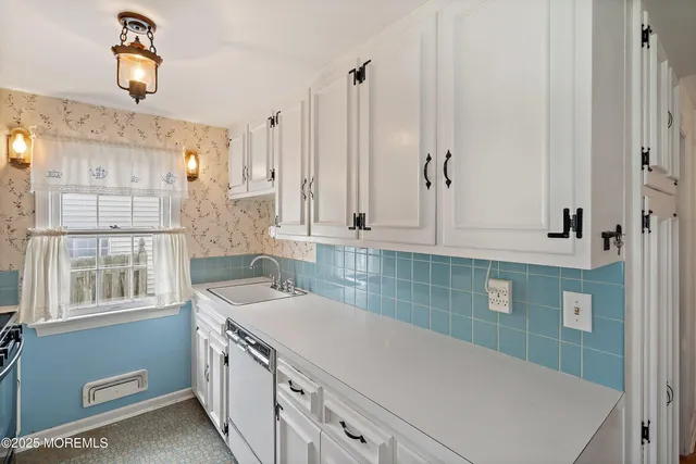 a bathroom with a sink a vanity and a mirror