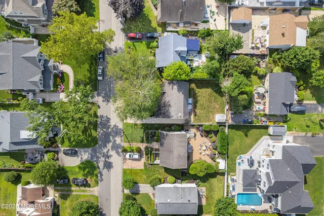 an aerial view of multiple house with yard