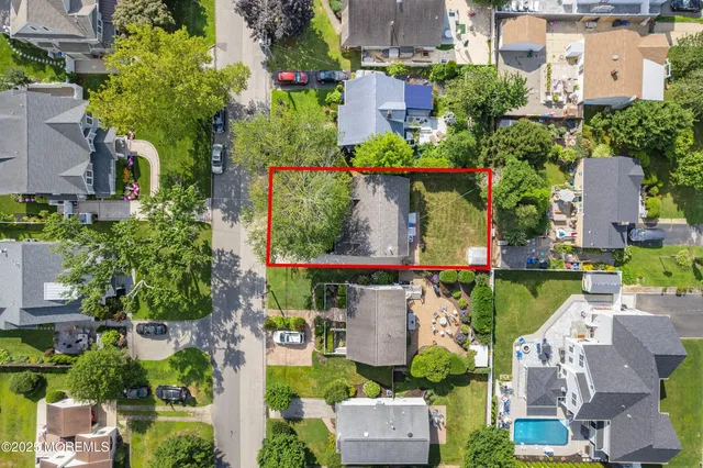 an aerial view of multiple house with yard