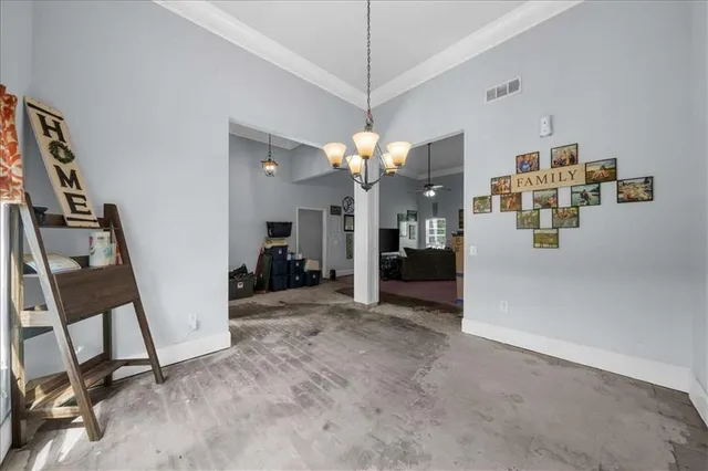a view of a livingroom with furniture and a flat screen tv