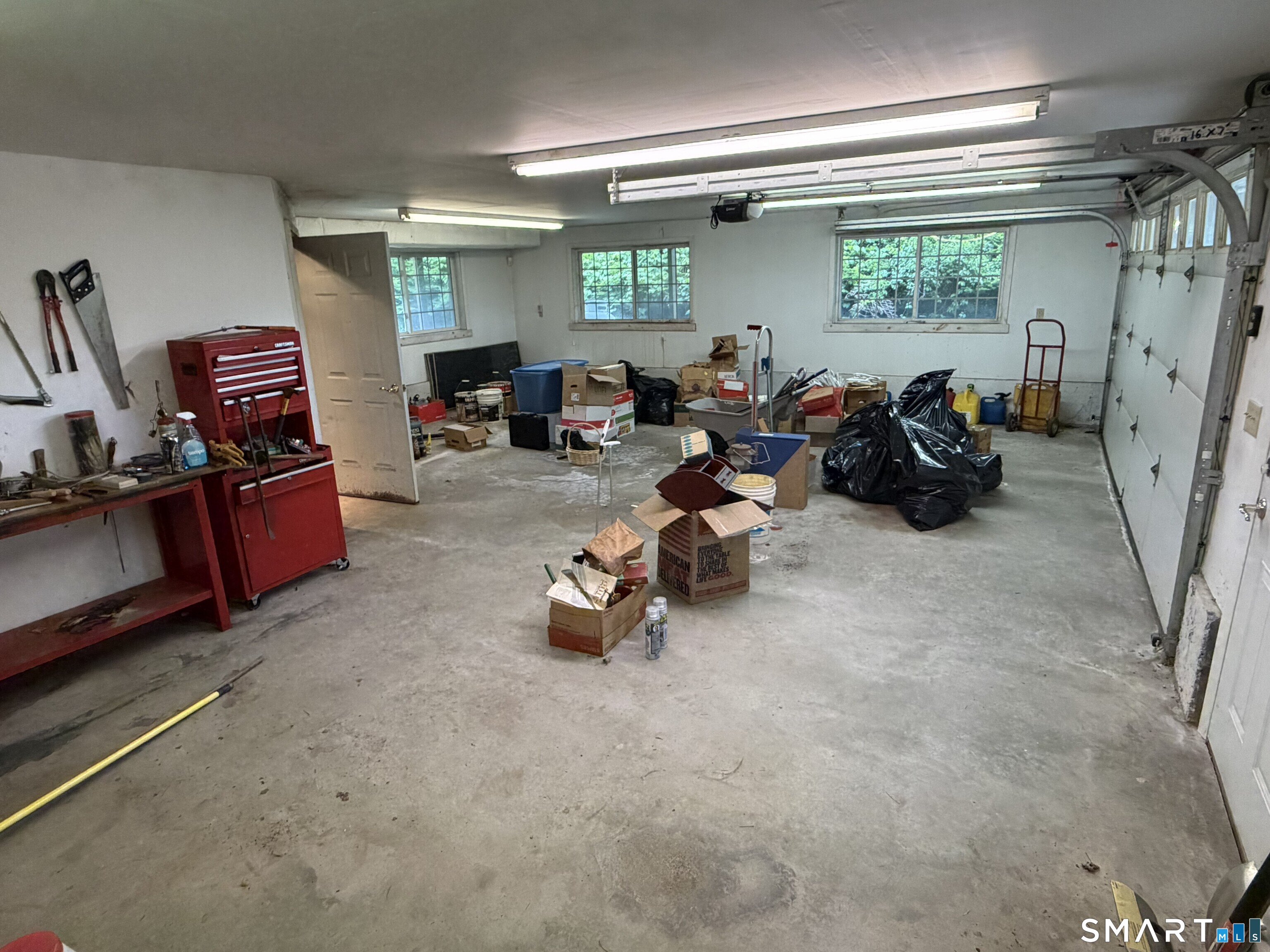 165 Huntington Road Scotland, CT 06264 - Photo 25 of 34 a room with furniture a window and gym equipment