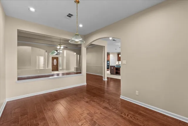 a living room with stainless steel appliances kitchen island furniture and a kitchen view