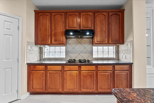 a bed room with a bed couch and a large window