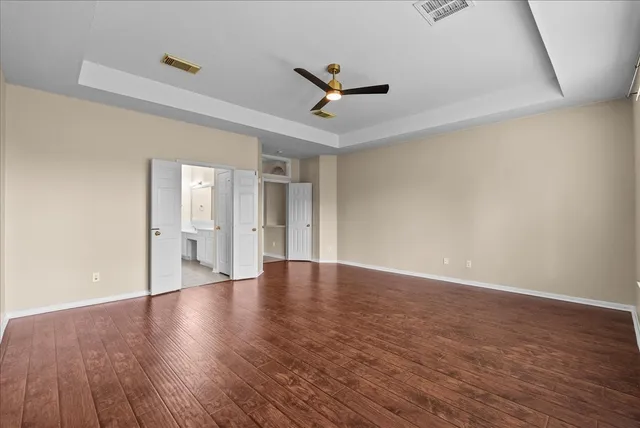 a bathroom with a glass shower door and a bathtub