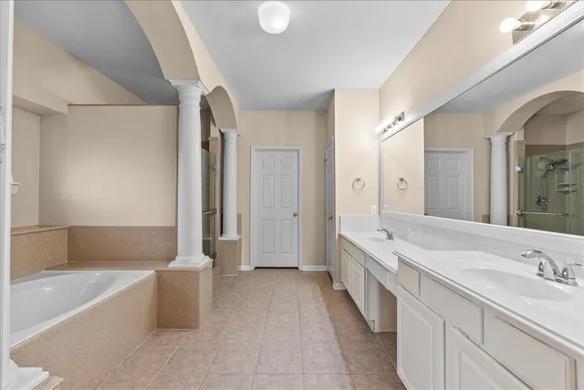 a bathroom with a granite countertop sink mirror and double