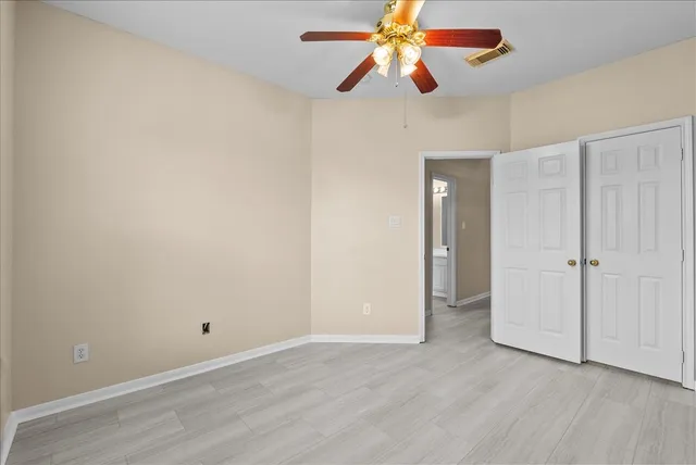 a bathroom with a tub a sink and mirror