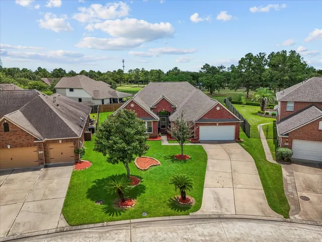 an aerial view of house with yard