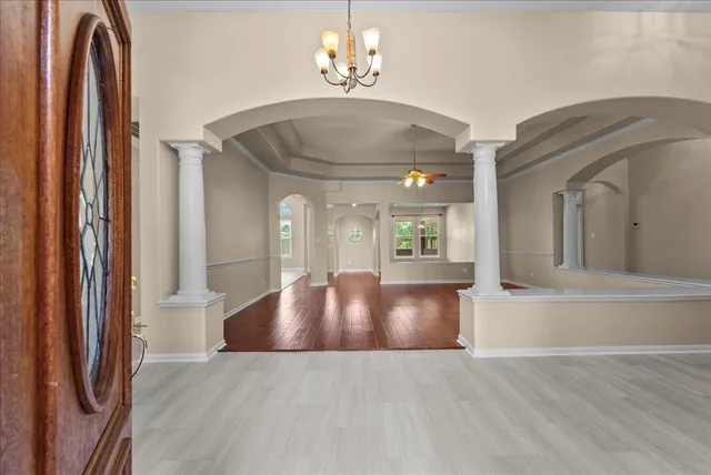a view of an entryway with wooden floor