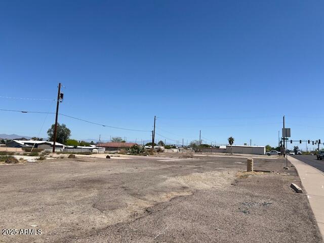 4208 East Baseline Road, Unit 5 Phoenix, AZ 85042 - Photo 1 of 9 a view of a ocean with a building in the background