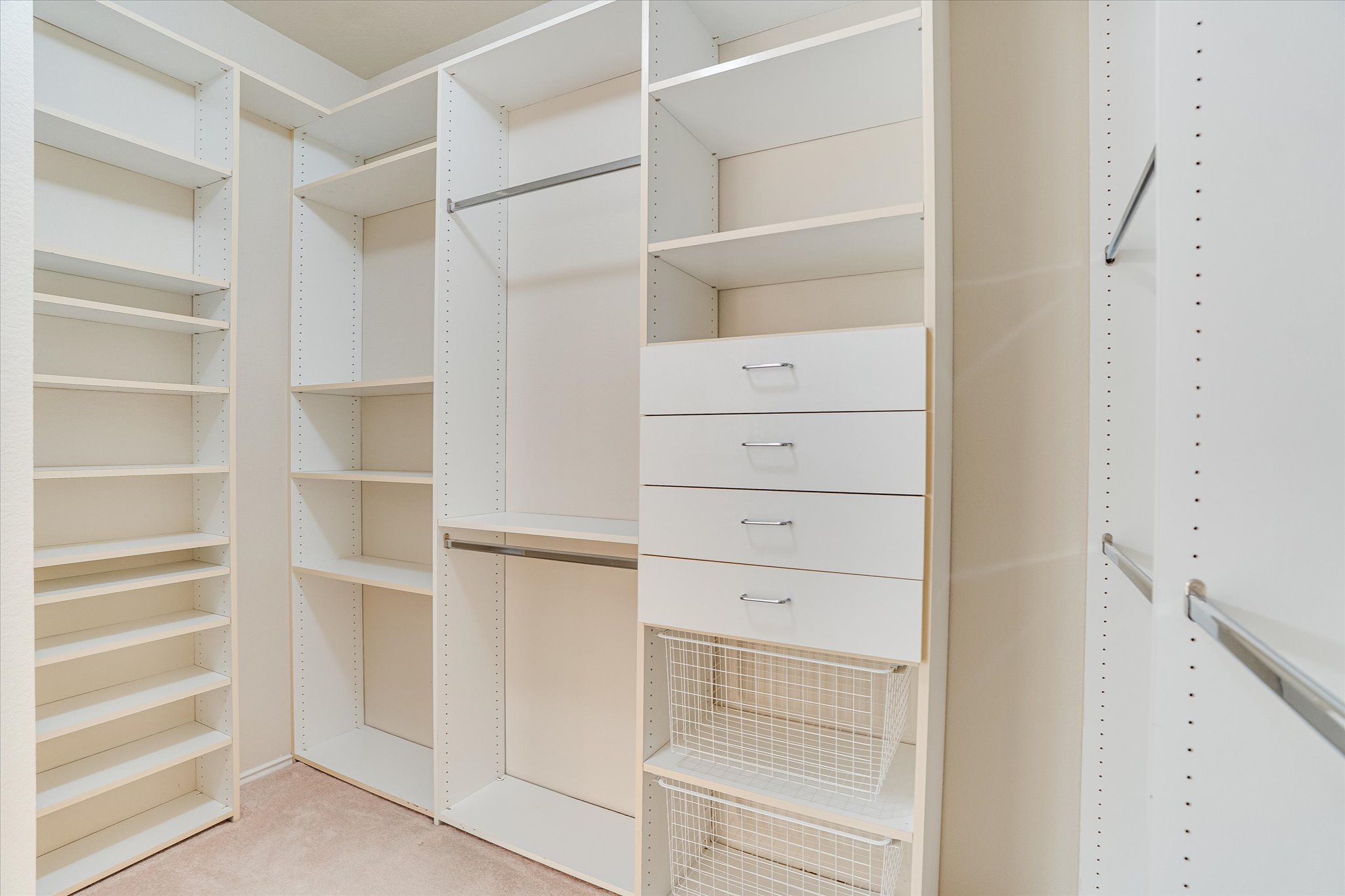 2207 Clover Ridge Drive Cedar Park, TX 78613 - Photo 16 of 25 Primary bedroom walk in closet with drawers and adjustable shelves