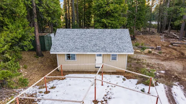 aerial view of a house with a yard