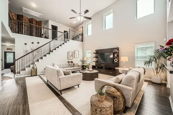 a living room with furniture and a flat screen tv