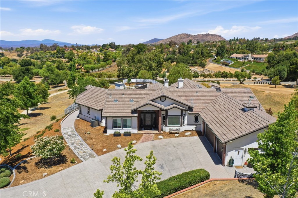 41110 Los Ranchos Circle Temecula, CA 92592 - Photo 75 of 77 a aerial view of a house with a big yard
