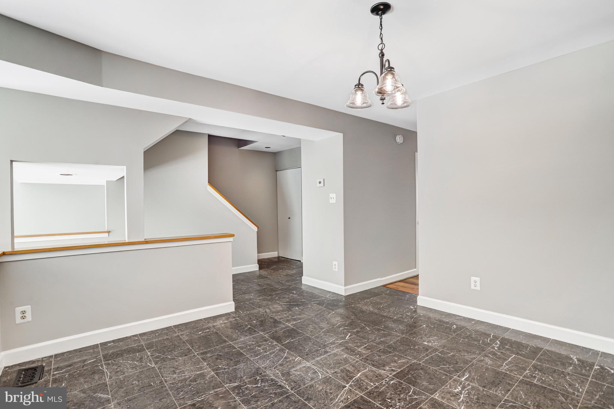 1953 Lakeport Way Reston, VA 20191 - Photo 8 of 60 a view of a hallway with chandelier and entryway