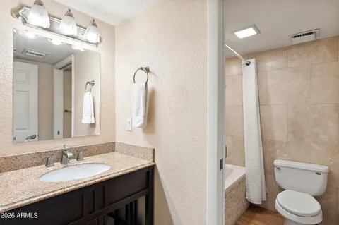 a front view of a house with trees