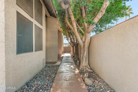 a kitchen with granite countertop stainless steel appliances white cabinets granite counter tops and a window