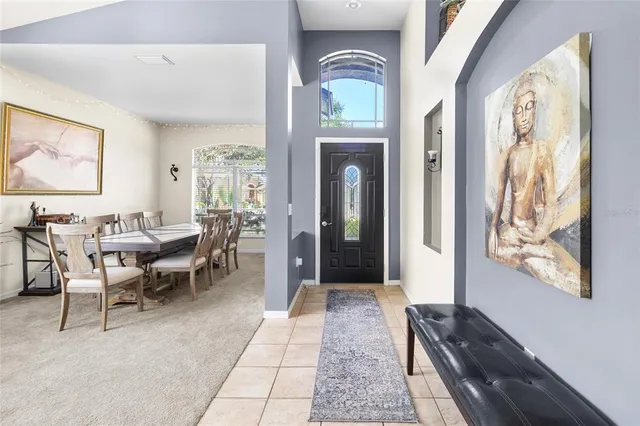 a kitchen with cabinets and chairs