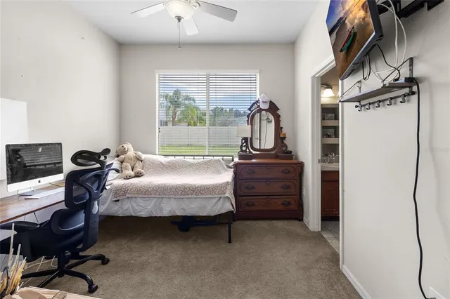 a bathroom with a sink a toilet and shower curtain