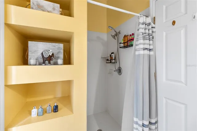 a bedroom with a bed and a television