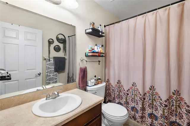 a livingroom with furniture and a flat screen tv