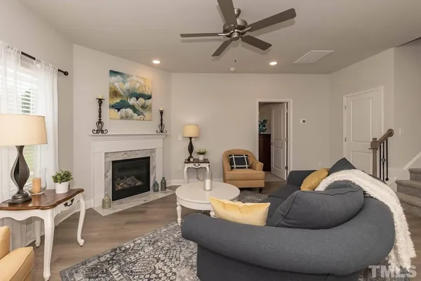 a living room with furniture and a fireplace