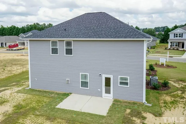 a aerial view of a house with a yard