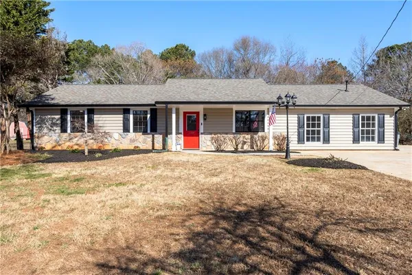 front view of a house with a yard