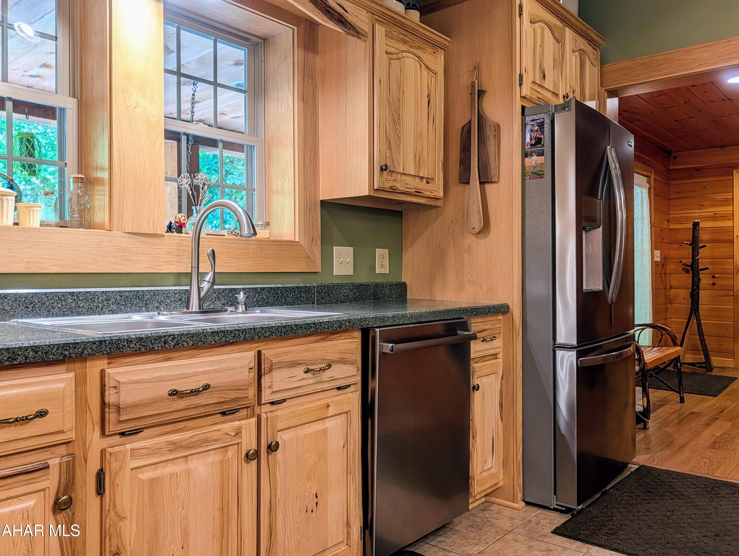213 Sherman Valley Road Hopewell, PA 16650 - Photo 15 of 104 a kitchen with stainless steel appliances granite countertop a refrigerator and a sink