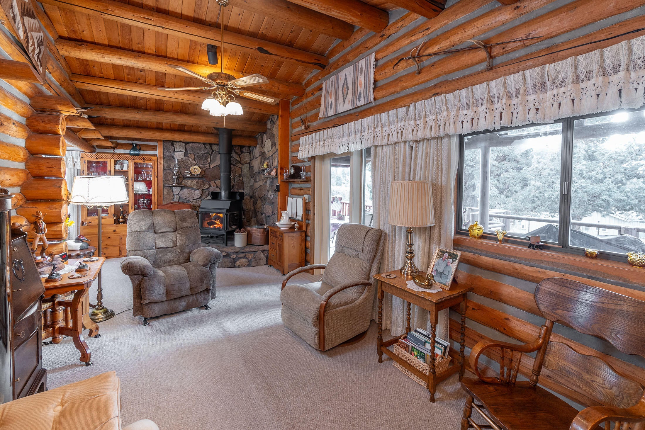 60384 Arnold Market Road Bend, OR 97702 - Photo 18 of 93 Living area looking towards the stone fireplace area where you can have a wood stove, pellet stove, or propane stove if desired.